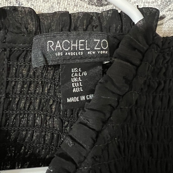 Long sleeve black blouse with light sparkles. Sheer sleeves - Picture 2 of 3